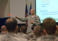 Chief Master Sgt. Michael Klausutis, the 919th Special Operations Wing command chief, talks to his Airmen in one of two enlisted calls held at Duke Field during the February unit training assembly.  Topics covered by the chief were the status of the 919th mission and future of the wing, physical training, education and development.  (U.S. Air Force photo/Tech. Sgt. Samuel King Jr.)