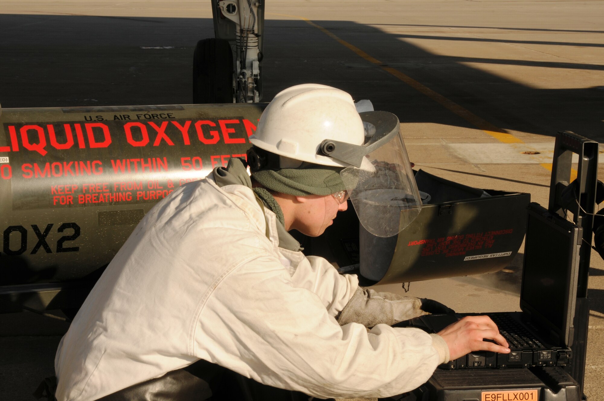Airman 1st Class Zak Skelton reviews a technical order prior to  a liquid oxygen servicing procedure on an A-10 Thunderbolt II at Selfridge Air National Guard Base, Mich., Feb. 5, 2012. Skelton is a crew chief with the 127th Aircraft Maintenance Squadron, a component of the Michigan Air National Guard. (U.S. Air Force photo by TSgt. David Kujawa)