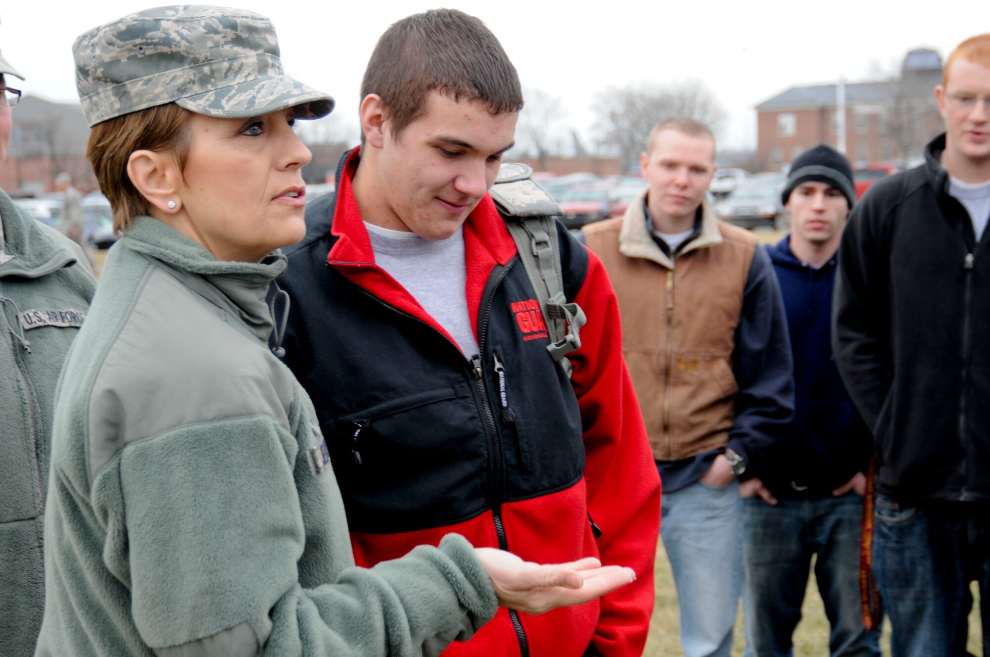 CMSgt. Denise Jelinski-Hall prepares to give her coin to Justin Forton, a new enlistee in the Michigan Air National Guard. Jelinski-Hall is the senior enlisted leader for the National Guard Bureau. She visited Selfridge Air National Guard Base, Mich., on Feb. 4, 2012, as part of a tour of several Michigan National Guard facilities. At each stop, she spoke to Airmen and Soldiers and sought their input on issues to take back to the senior leaders of the Guard. (U.S. Air Force photo by TSgt. David Kujawa)