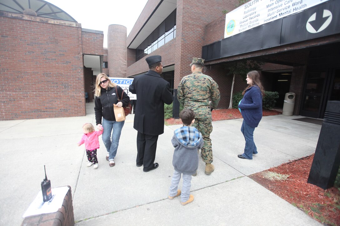 Seaman Recruit Michael Scalfe, a corpsman with the Naval Hospital Camp Lejeune points a service member and his family in the right direction following the temporary closure of the naval hospital’s main entrance, Feb. 6. The hospital’s quarterdeck is currently undergoing renovations and, once completed, will be more open and brighter.