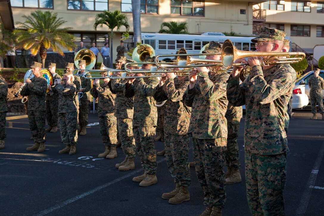 Members of the U.S. Marine Corps Forces, Pacific Band perform during a flagpole rededication ceremony here, Feb. 6. The band provided music throughout the ceremony, to include playing the national anthem as a detail of Marines hoisted the flag for morning colors. More than a hundred service members and civilians attended the flag raising and rededication ceremony. After standing tall for more than 56 years, the old flagpole had started to rust internally and needed to be replaced. The project forced a two-week hiatus of morning and evening colors aboard the base.