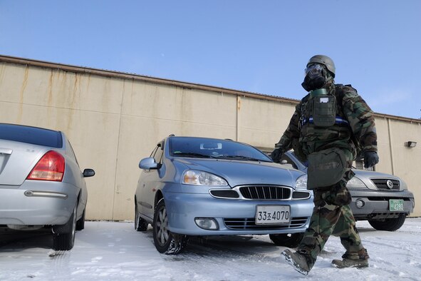 Tech. Sgt. Steven Jackson, 8th Comptroller Squadron deputy dispersing officer, completes post-attack reconnaissance around his facility at Kunsan Air Base, Republic of Korea, during a peninsula-wide operational readiness exercise Feb. 2, 2012. Kunsan participated in a PENORE to test its ability of performing during wartime conditions no matter what the season may be. (U.S. Air Force photo by Staff Sgt. Rasheen A. Douglas/Released)