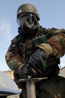 Tech. Sgt. Steven Jackson, 8th Comptroller Squadron deputy dispersing officer, changes chemical agent detection paper (M8) at a stanchion outside his facility at Kunsan Air Base, Republic of Korea, during a peninsula–wide operational readiness exercise Feb. 2, 2012. Kunsan participated in a PENORE to test its ability of performing during wartime conditions no matter what the season may be. (U.S. Air Force photo by Staff Sgt. Rasheen A. Douglas/Released)