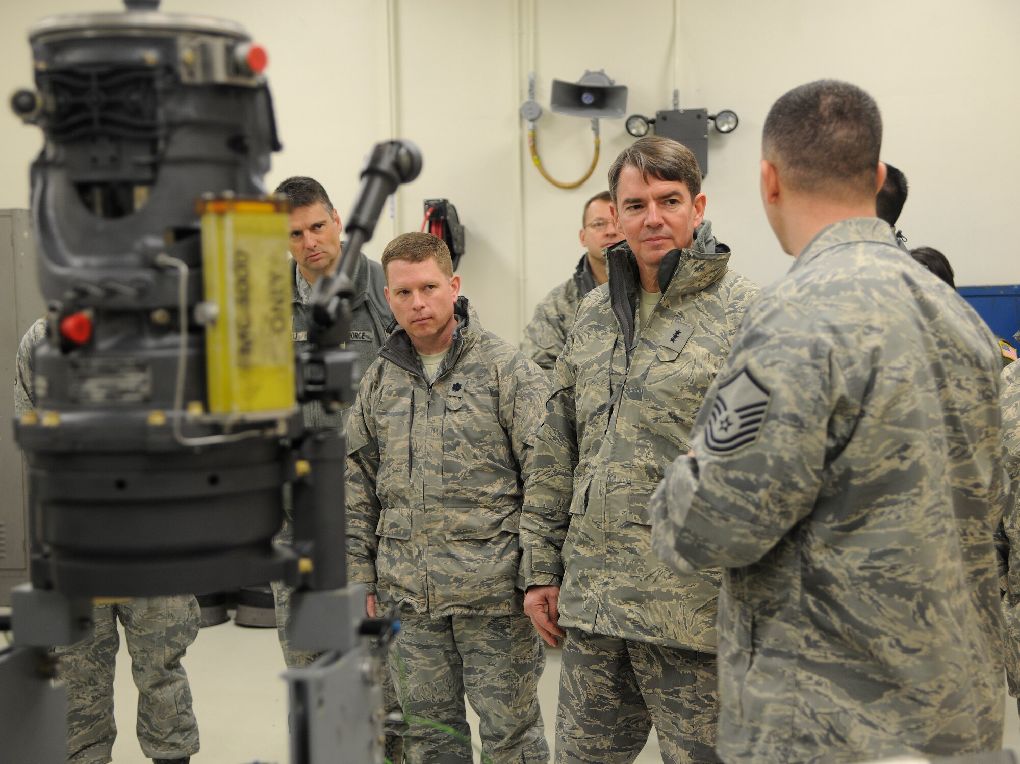 Lt. Gen. Jan-Marc Jouas, 7th Air Force commander, listens to Master Sgt. James Price, 8th Maintenance Squadron armament flight chief, as he shows him around the new maintenance facility at Kunsan Air Base, Republic of Korea, Jan. 27, 2012. Jouas’ visit to the Wolf Pack was his first since assuming command of the 7th AF.  (U.S. Air Force photo by Staff Sgt. Rasheen A. Douglas/Released)