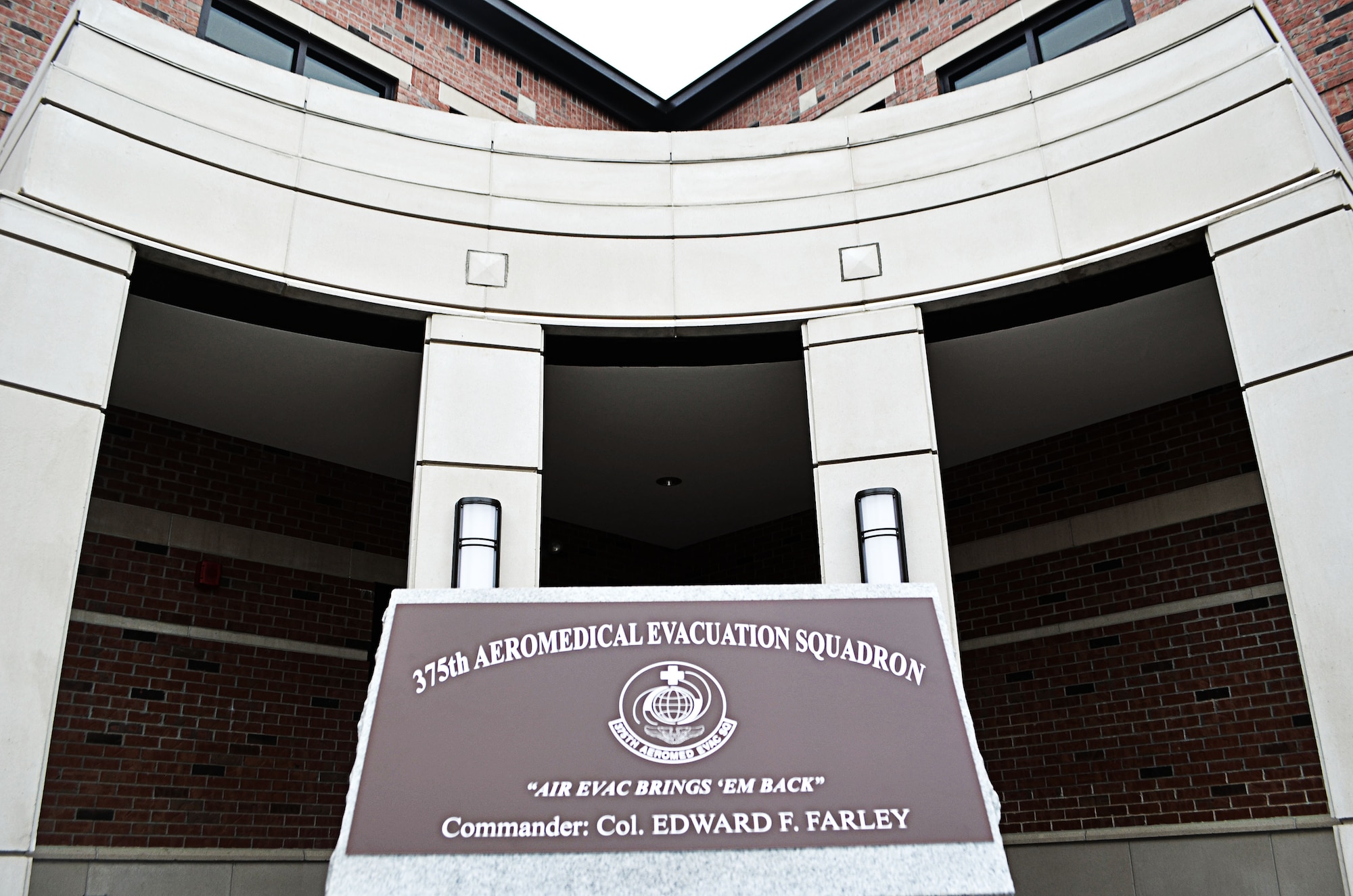 The front entrance to the new $7.4 million, 21,500 sq. ft. building which houses the 375th Aeromedical Evacuation Squadron just moments before the Feb. 6, 2012 ceremonial ribbon cutting at Scott Air Force Base, Ill.  This building represents where the Air Force is going in new construction—LEED certification, which stands for Leadership, Energy and Environmental Design—which provides a framework for designers to work toward sustainable buildings. For Scott AFB, that means energy efficiency, being better to the environment and saving money in operational costs.  The Air Force designs its buildings toward a “silver” certification award,  and Scott AFB hopes to earn a “Gold” LEED certification. (U.S. Air Force photo/Karen Petitt)