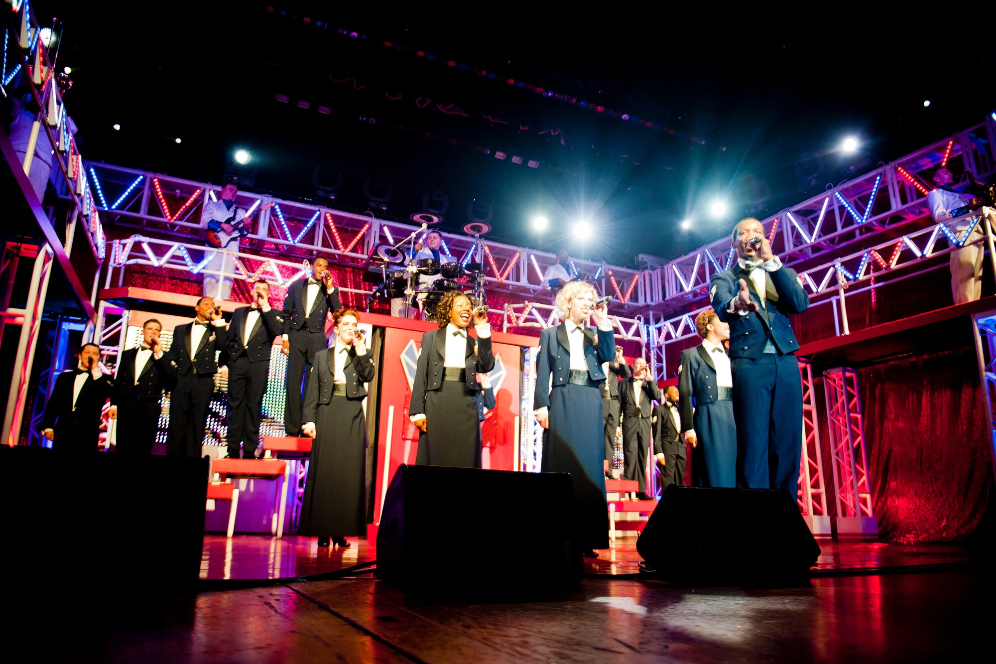 Tops in Blue members perform one of their final sets at the Mathis Auditorium, Valdosta, Ga., Feb. 2, 2012. The group ended the show singing musical pieces commemorating those who lost lives during 9/11 and the Service members who sacrificed during the wars since the tragic event. (U.S. Air Force photo by Staff Sgt. Jamal D. Sutter/Released) 