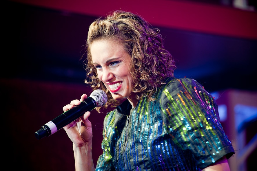 U.S. Air Force Senior Airman Kristen Wash, Tops in Blue vocalist, performs during a show at the Mathis Auditorium, Valdosta, Ga., Feb. 2, 2012. Tops in Blue tours worldwide in an effort to raise morale for Service members and their families. While entertaining, they also promote community relations, support recruiting efforts and serve as ambassadors for the U.S. and the Air Force. (U.S. Air Force photo by Staff Sgt. Jamal D. Sutter/Released)