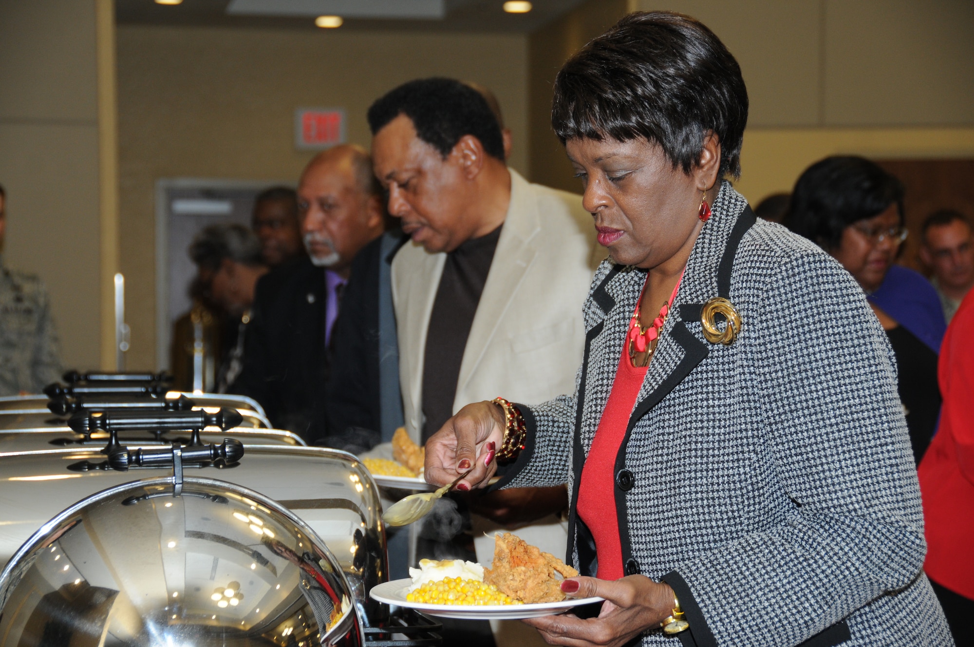 Linda Brundidge, 81st Medical Support Squadron, and her husband Marvin, retired, go through the buffet line during the Black History Month luncheon, Feb. 2, 2012, at the Bay Breeze Event Center, Keesler Air Force Base, Miss.  The luncheon was hosted by the African American Heritage Committee and the guest speaker for the event was Sally-Ann Roberts.  (U.S. Air Force photo by Kemberly Groue)