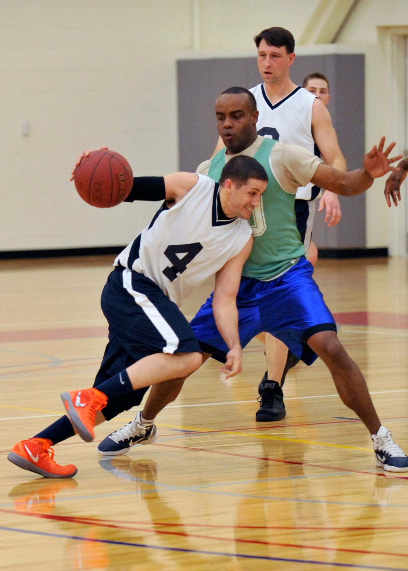 Wesley Glatfelter, guard for the 436th Communications Squadron, attempts to drive to the hoop around a 436th Security Forces Squadron defender during an intramural basketball Feb. 2, Dover Air Force Base, Del. The 436th CS upset the previously unbeaten 436th SFS 46-31. (U.S. Air Force photo by Tech. Sgt. Chuck Walker)
