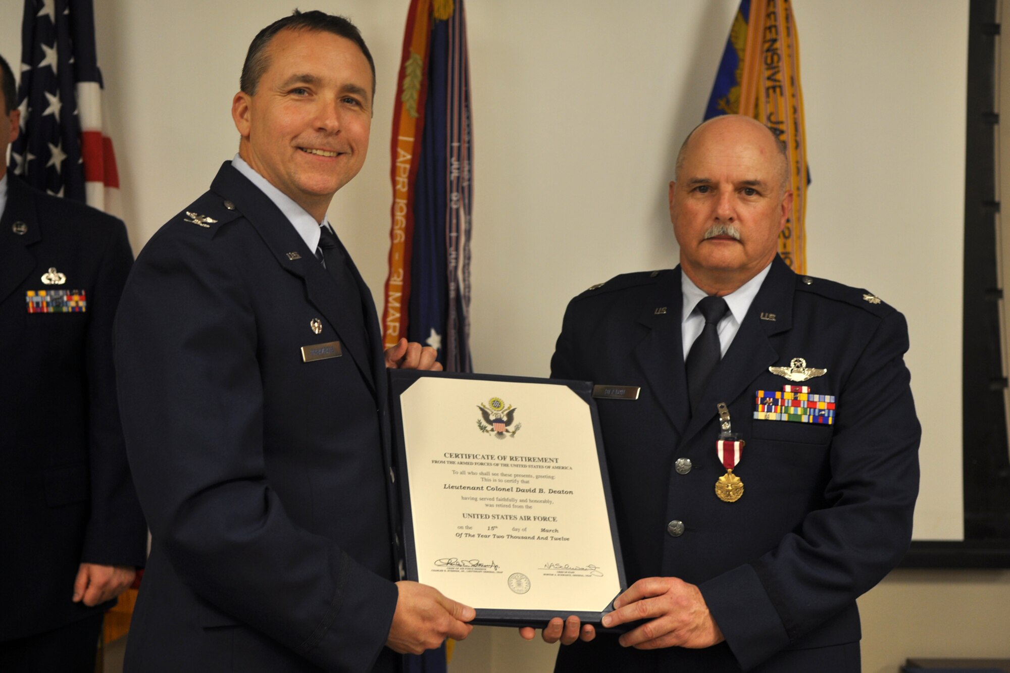 Col. John Breazeale, commander of the 917th Fighter Group, and Retired Lt. Col. David B. Deaton pose for a photo during retirement ceremonies at Barksdale Air Force Base, La., Feb. 3, 2012. (U.S. Air Force photo by Master Sgt. Jeff Walston)  