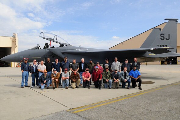 The team that worked on the F-15E following damage from a birdstrike. The aircraft was returned to Seymour Johnson Air Force Base, N.C., after a year of maintenance work, including replacing the aft fuselage. (Photo by Sue Sapp) 

