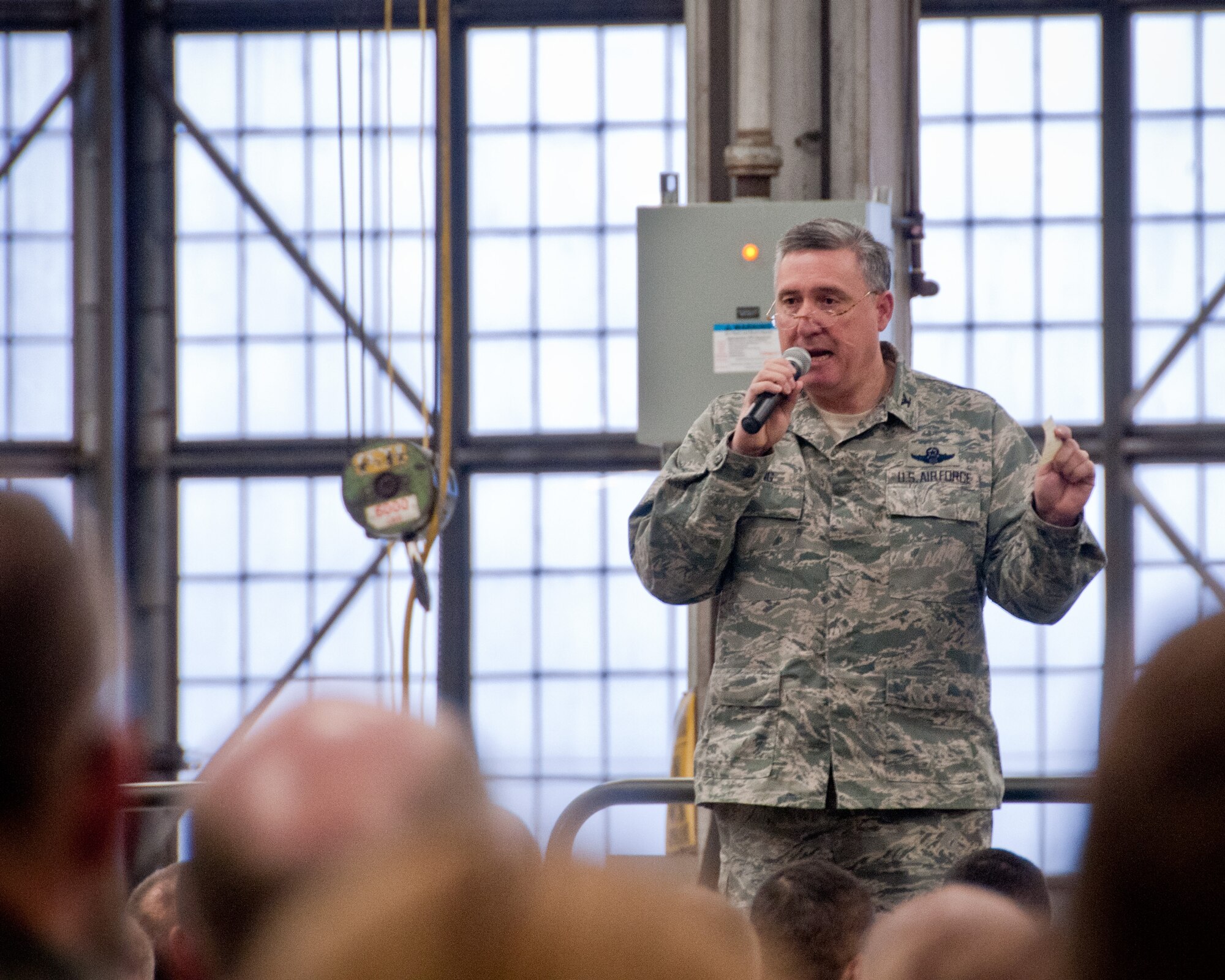 Col. Darrell G. Young, 934th Airlift Wing commander, briefs unit members about the recent force structure change announcement and how it may affect the 934th AW during a morning wing commander's call. (Air Force Photo/TSgt. Jim Loehr)