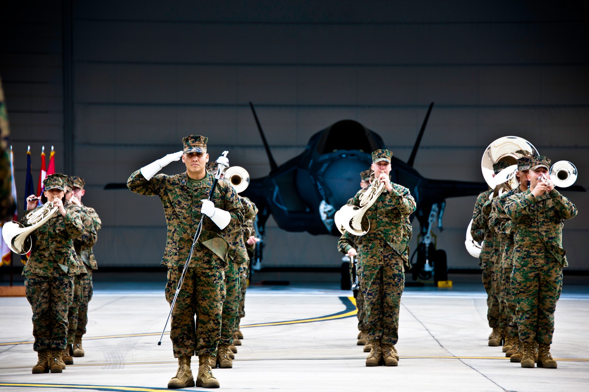 Drum Major Gunnery Sgt. Victor Miranda salutes the commander of Marine Fighter Attack Squadron 501 as the 2nd Marine Aircraft Wing Band plays at the closing of the squadron’s change of command ceremony Feb. 3 at Eglin Air Force Base, Fla.  The band is headquartered at Marine Corps Air Station Cherry Point, N.C. (U.S. Air Force photo/Samuel King Jr.)