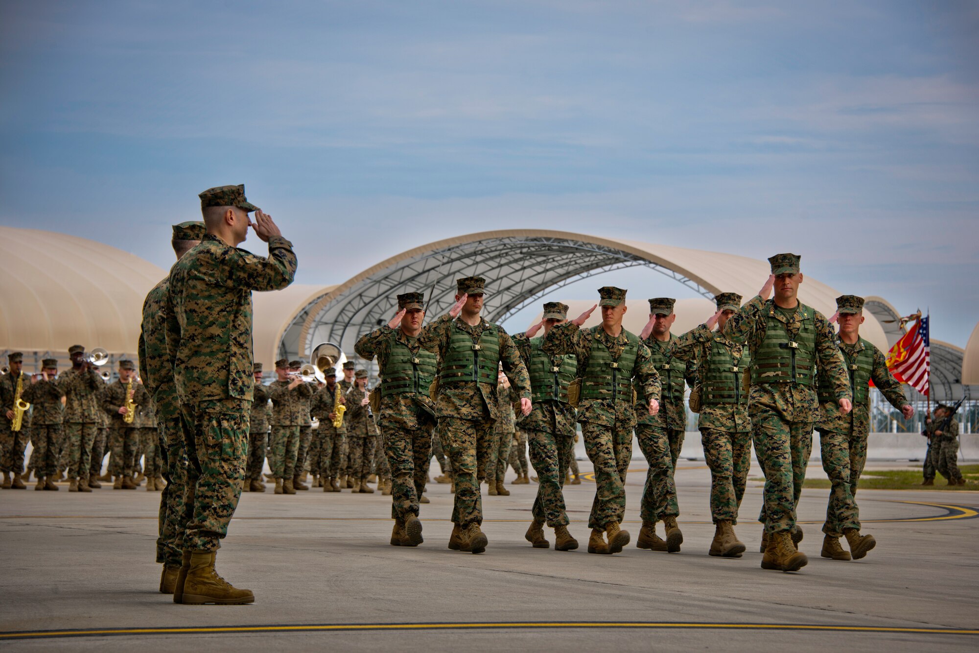 Lt. Col. David Berke salutes his new squadron as members of Marine Fighter Attack Squadron 501 march by at the end of his change of command ceremony Feb. 3 at Eglin Air Force Base, Fla.  (U.S. Air Force photo/Samuel King Jr.)