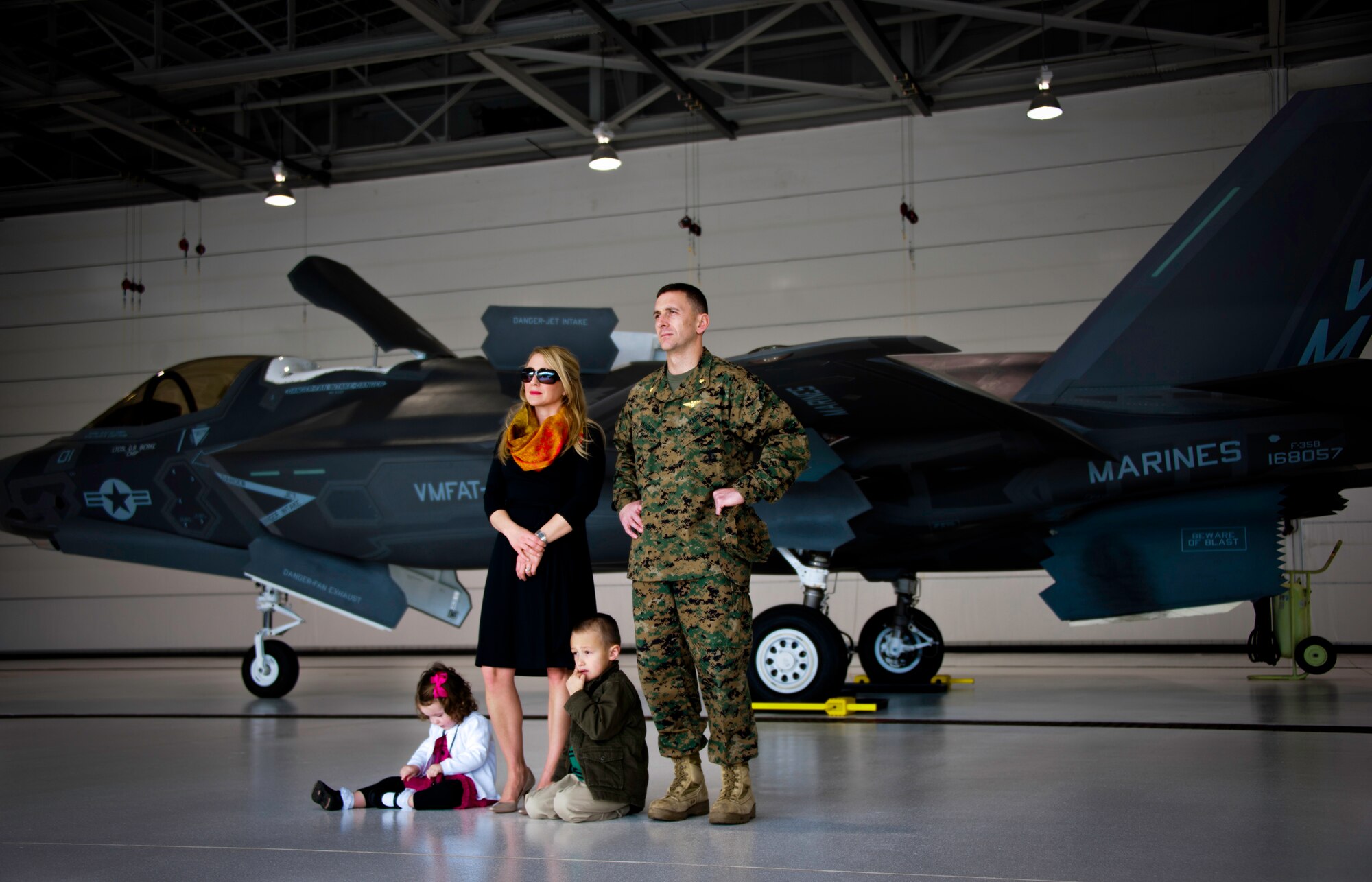 Maj. Chad Vaughn and his family stand in front of the F-35B Lightning II joint strike fighter while watching the Marine Fighter Attack Squadron 501 change of command ceremony Feb. 3 at Eglin Air Force Base, Fla.  (U.S. Air Force photo/Samuel King Jr.)