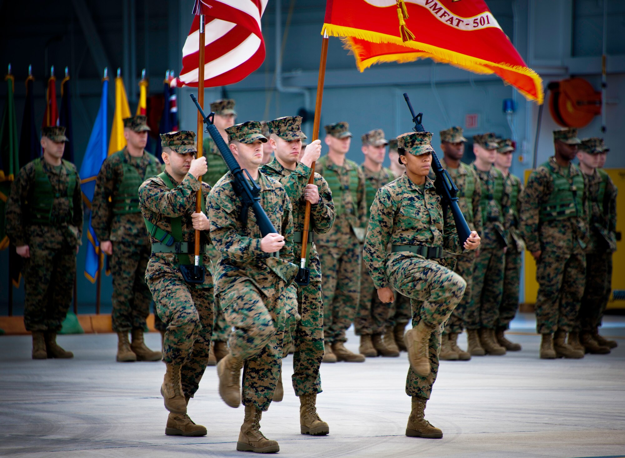 Marines from the Marine Fighter Attack Squadron 501 move the colors during the squadron’s change of command ceremony Feb. 3 at Eglin Air Force Base, Fla.  The squadron stood up in April 2010 and currently has approximately 89 Marines here.  (U.S. Air Force photo/Samuel King Jr.)