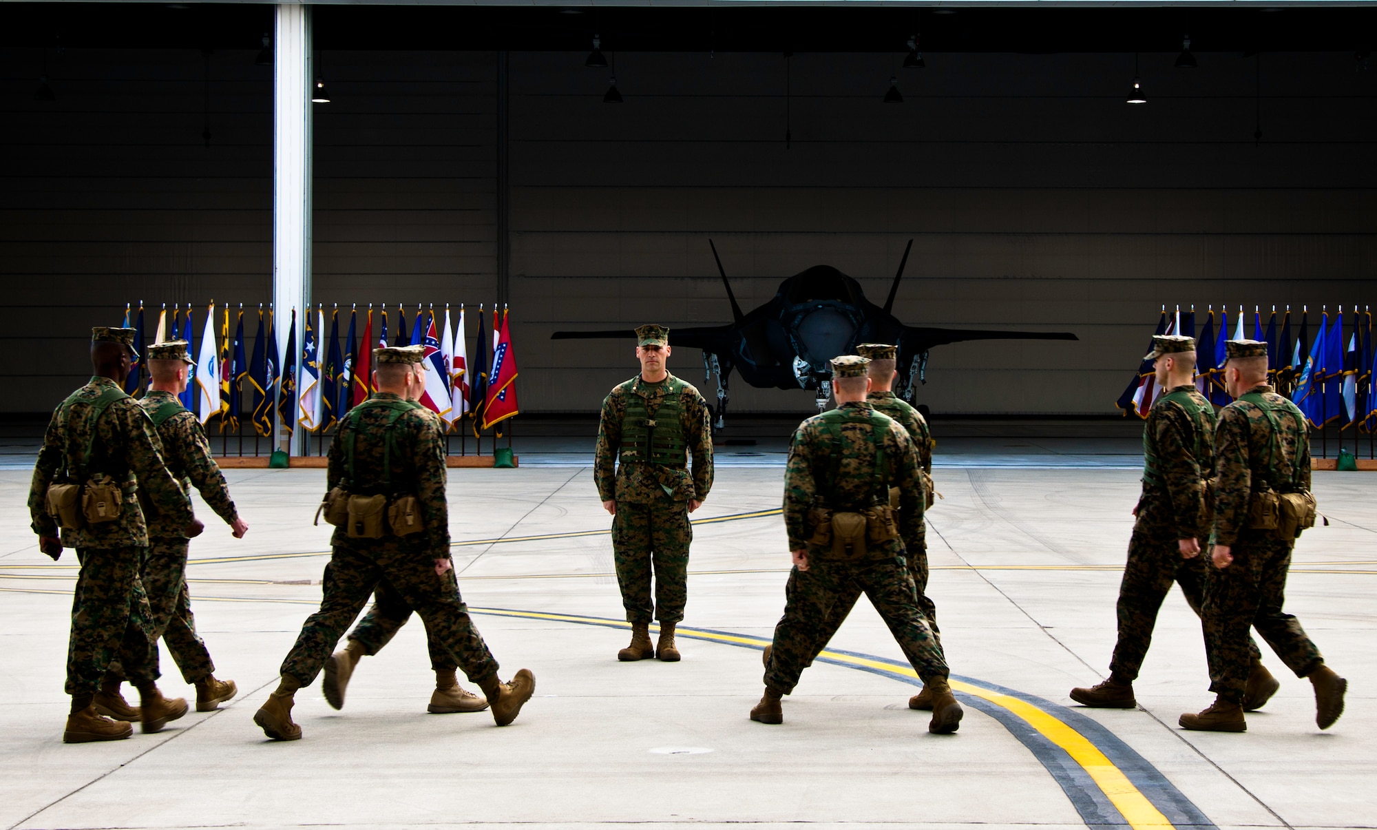 Marines move into position in front of the commander of troops, Maj. Steve Gillette, of the Marine Fighter Attack Squadron 501, during the squadron’s change of command ceremony Feb. 3 at Eglin Air Force Base, Fla.  The squadron stood up in April 2010 and currently has approximately 89 Marines here.  (U.S. Air Force photo/Samuel King Jr.)
