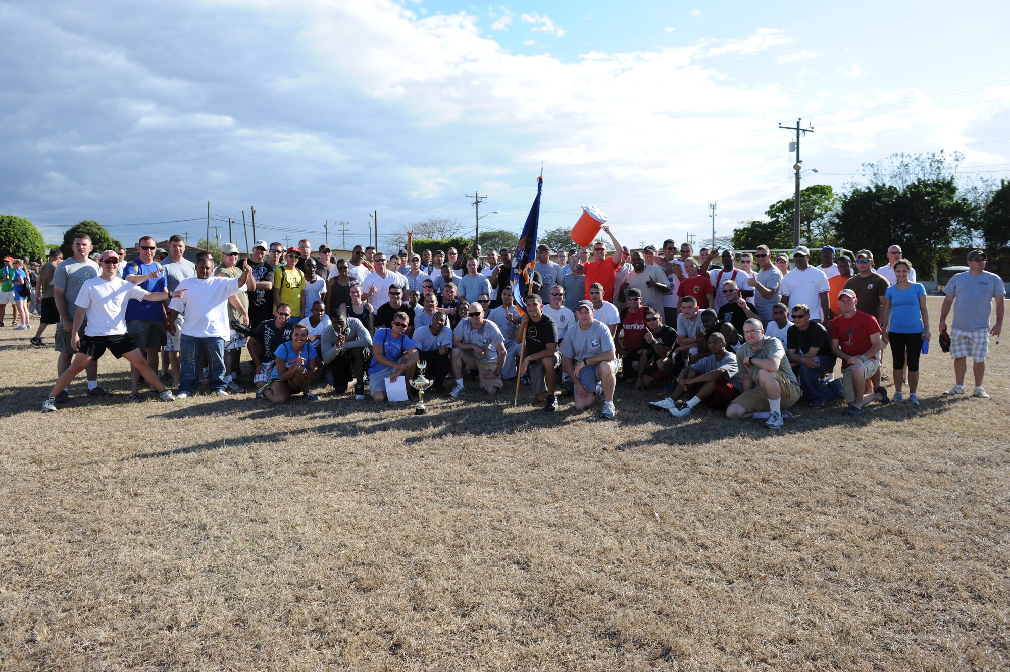 SOTO CANO AIR BASE, Honduras - Members of the 1st Battalion, 228th Aviation Regiment here, pose for a group photo after winning Joint Task Force-Bravo's quarterly Organizational Day Feb. 3, 2012.  The battalion remains the Org Day reigning champs since clinching that honor in October 2011.  The purpose of the event was to provide team building between U.S. and Honduran military and civilians. The events of the day began with a two-mile run and included a triathlon, soccer, volleyball, basketball, dodge ball, football, a litter carry, and a relay race. (U.S. Air Force photo/Martin Chahin)