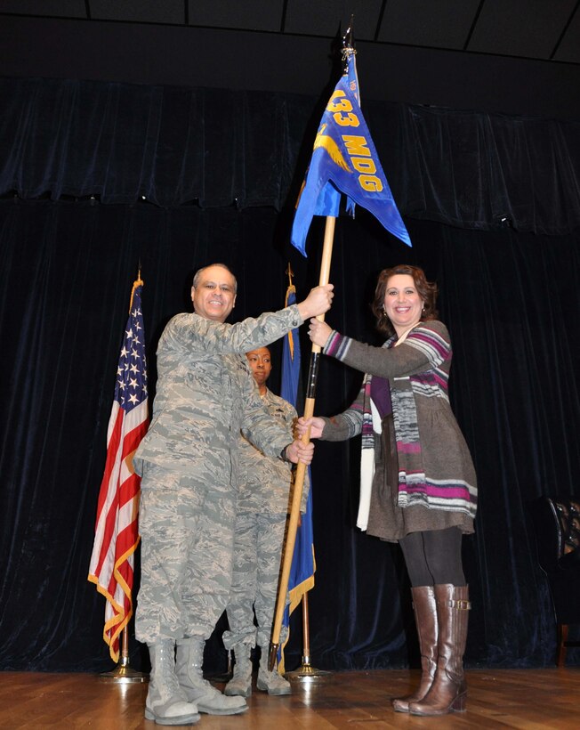 Dr. Sandra Guerra, Honorary Commander of the 433rd Aerospace Medicine Squadron, accepts the guidon from Lt. Col Ernest Vasquez as part of a change of command ceremony Feb 5.  The ceremony celebrated Dr. Guerra's acceptance of her role as an Honorary Commander. The 433rd Honorary Commanders program is designed to be a forum in which the 433rd Airlift Wing Commanders can dialogue and request input from San Antonio's civilian leaders on matters affecting military and civilian communities. The program is comprised of civic leaders and business people and was created to further strengthen community ties. The honorary commanders are assigned to squadrons and groups within the wing that are similar to the civilian duties and responsibilities. 

