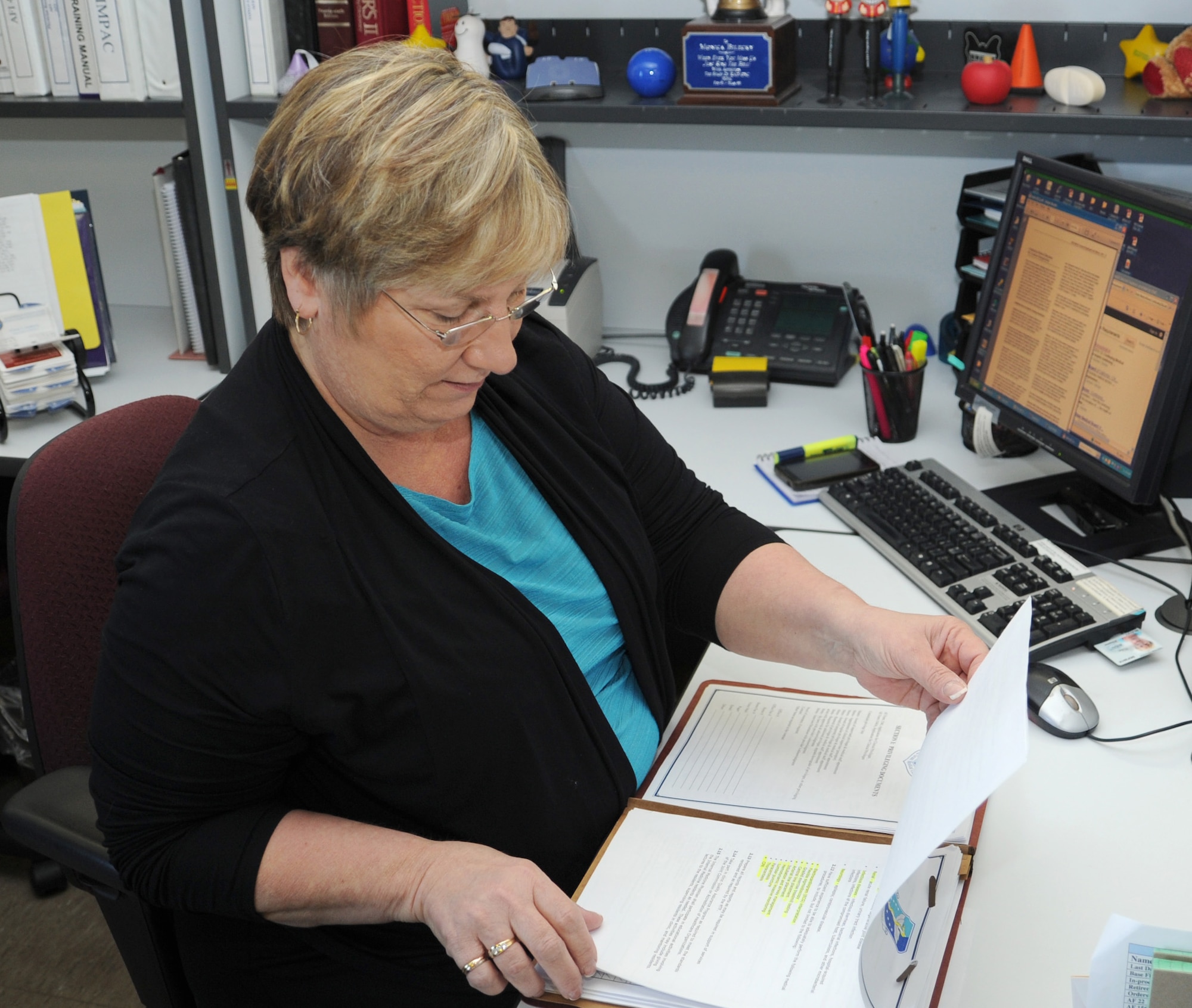 Mrs. Monica Bilecky, credential manager, verifies credential files at David Grant USAF Medical Center. (U.S. Air Force photo/ Staff Sgt. Liliana Moreno) 