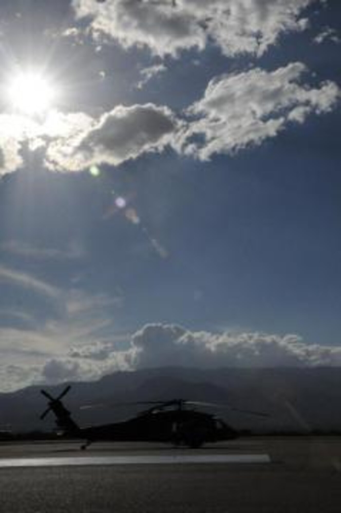 A lone UH-60 Blackhawk helicopter assigned to the 1-228th Aviation Regiment sits on the tarmac at Soto Cano Air Base, Honduras, Jan. 25. (U.S. Army photo/Eric Lucero)
