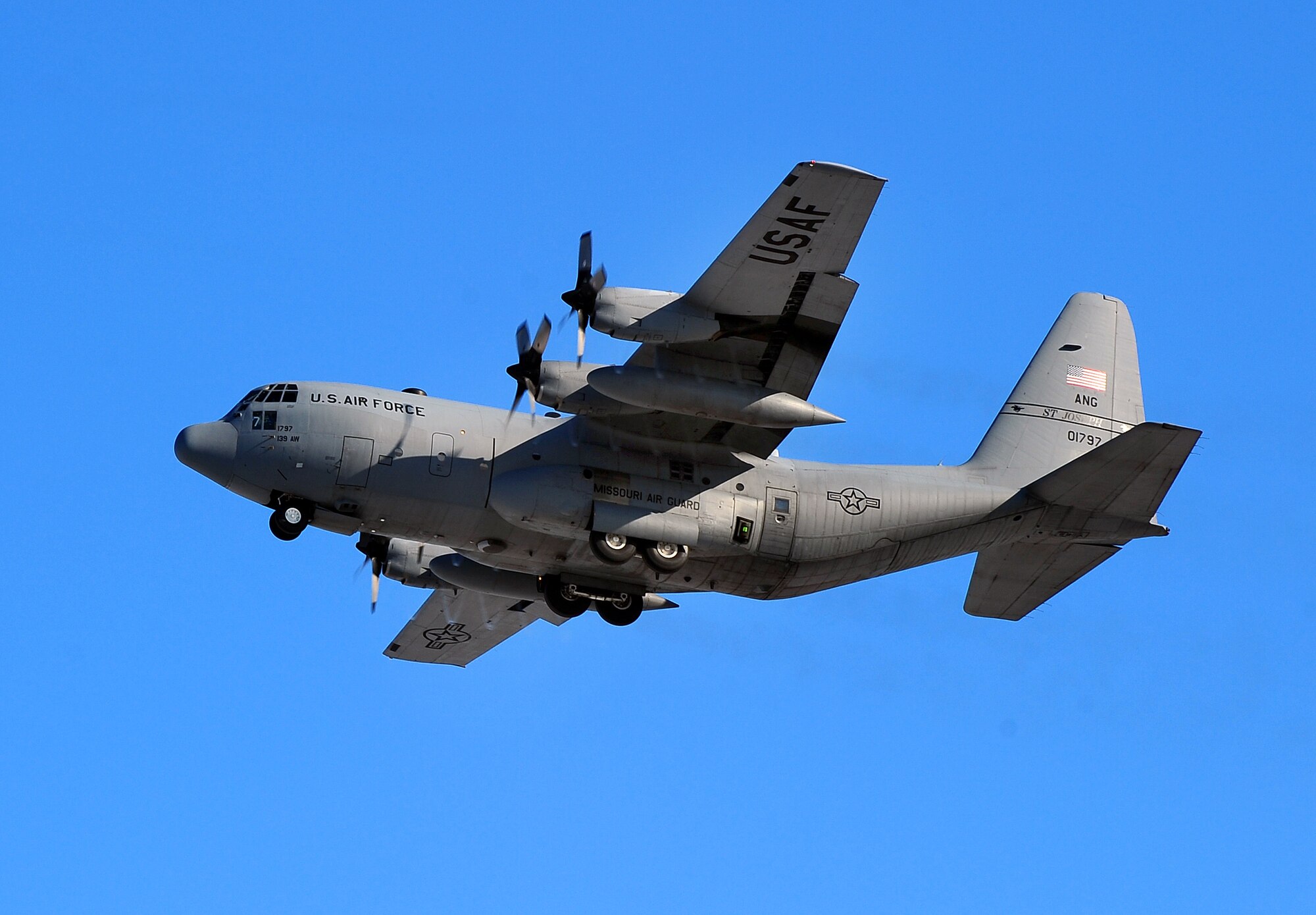 A Missouri Air National Guard C-130 cargo aircraft flies near Offutt Air Force Base, Neb., Dec. 6, 2011. (U.S. Air Force photo by Josh Plueger)