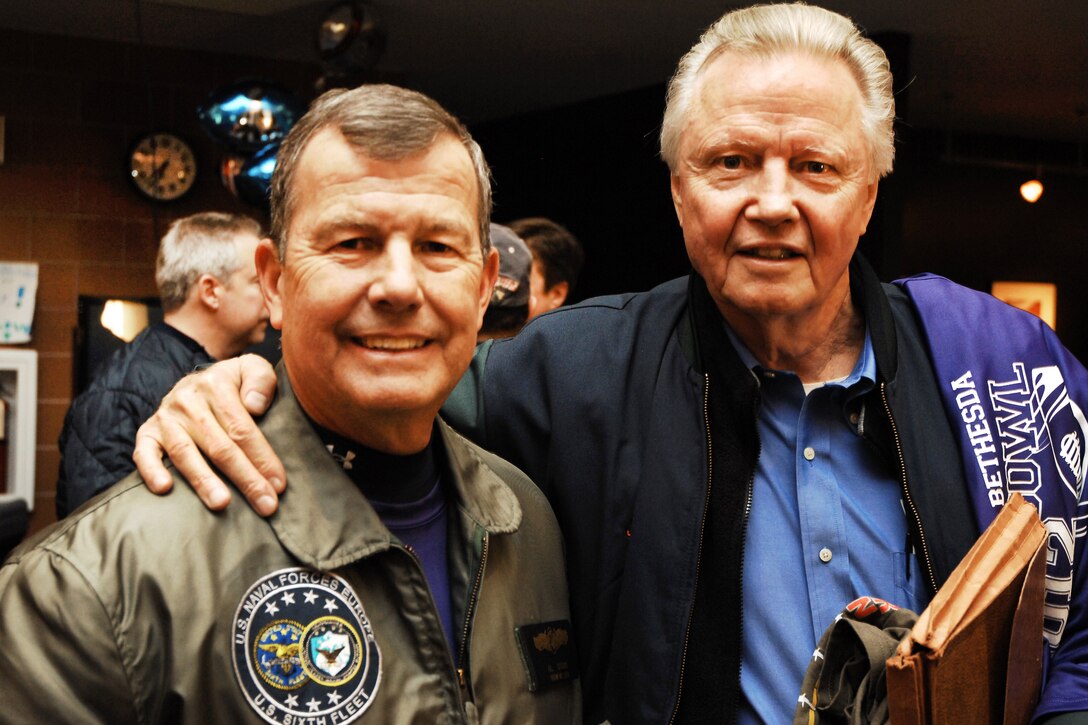 Navy Rear Adm. Alton L. Stocks, left, smiles as he and actor Jon Voight attend the Super Bowl party for wounded warriors at Walter Reed National Military Medical Center in Bethesda, Md., Feb. 5, 2012. Stocks is commanding officer at the medical center.