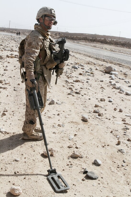 Lance Cpl. Andrew J. Rodriguez, point man with Weapons Company, 3rd Battalion, 7th Marine Regiment, sweeps for improvised explosive devices and clears a route during a foot patrol, Feb. 6. Rodriguez, a 19-year-old native of San Jose, Calif., led more than 120 patrols without an IED strike, and he detected three IEDs. His squad interacted with local villagers and searched the area for insurgent activity during the patrol.