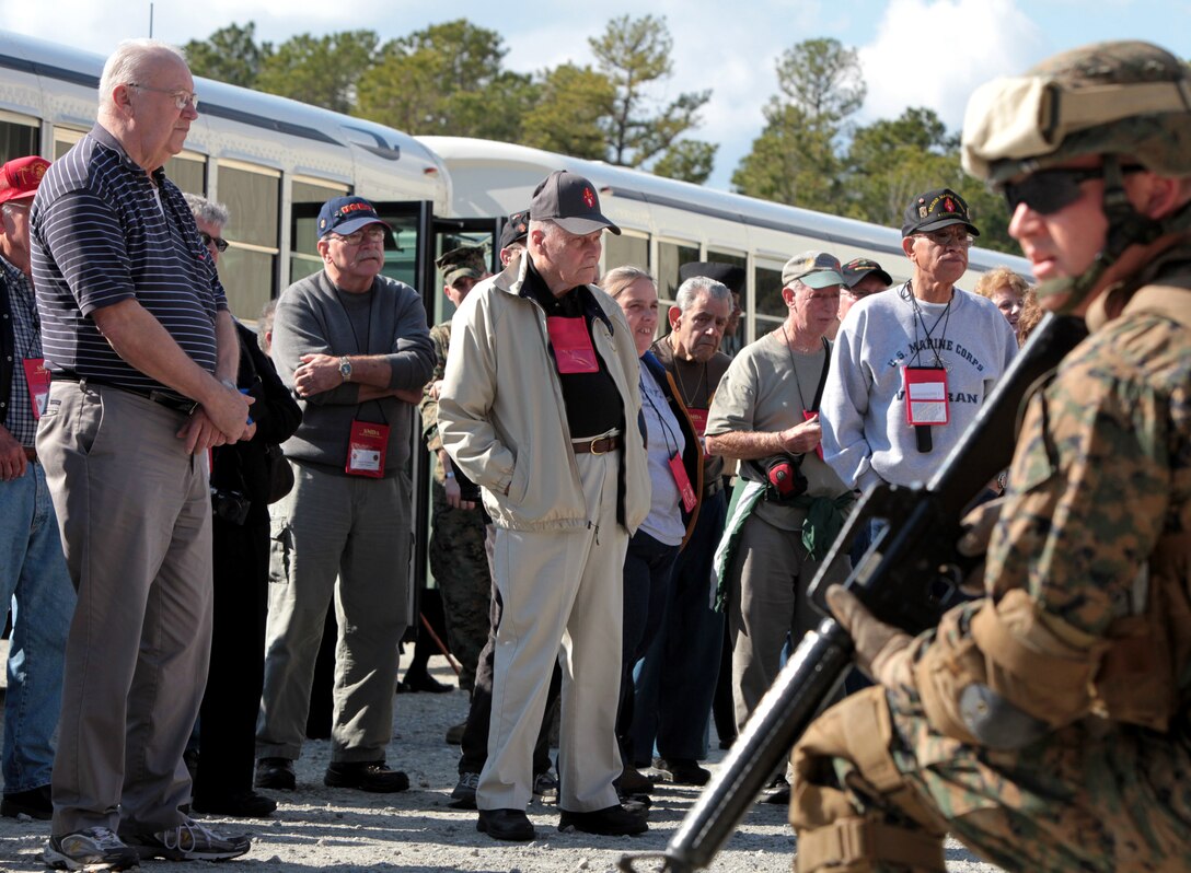 Members of the Second Marine Division Association, watch as a group of Marines conducts training in the Humvee Egress Assistance Trainer aboard Marine Corps Base Camp Lejeune, N.C., Feb. 2. The SMDA members were at the HEAT as part of the 2nd Marine Division’s 71st birthday celebration event.