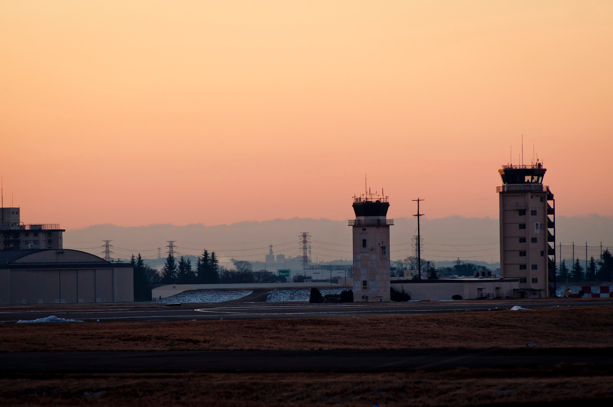 YOKOTA AIR BASE, Japan -- Dawn breaks over the flightline at Yokota Air Base, Japan, Jan. 31, 2012. Yokota serves as the hub for tactical airlift in the western Pacific. (U.S. Air Force photo/Staff Sgt. Samuel Morse)
