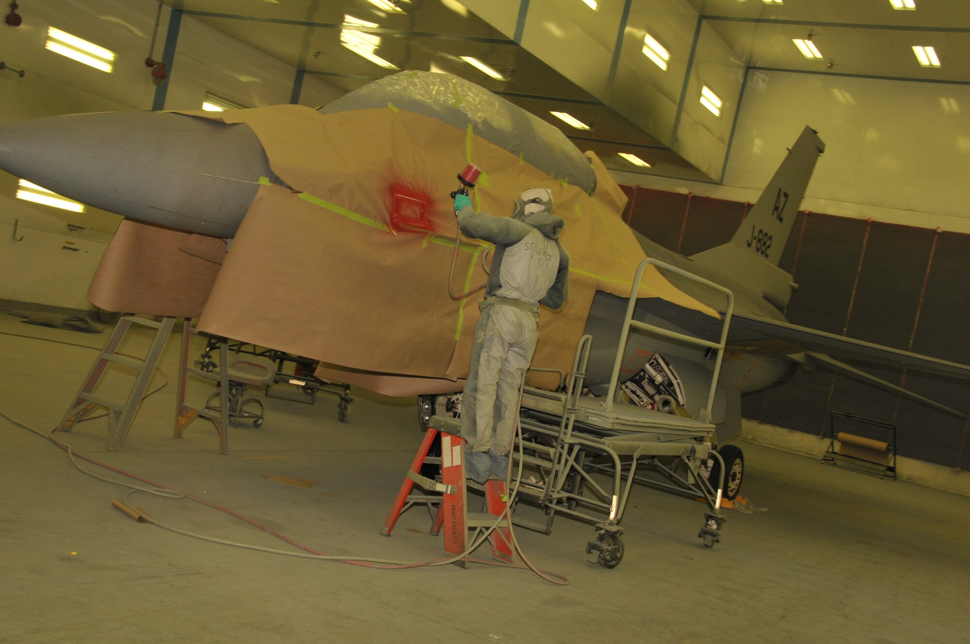 James Seiler, a painter from the Iowa Air National Guard Paint Facility, Sioux City, Iowa,  provides the finishing touches to an F-16 from the Royal Netherlands Air Force. This is the first time the paint facility has worked with an international aircraft. The facility will service six Dutch F-16s in 2012. 

USAF Photo Staff Sgt. Rich Murphy, 185th Air Refueling Wing, Iowa Air National Guard (released) 