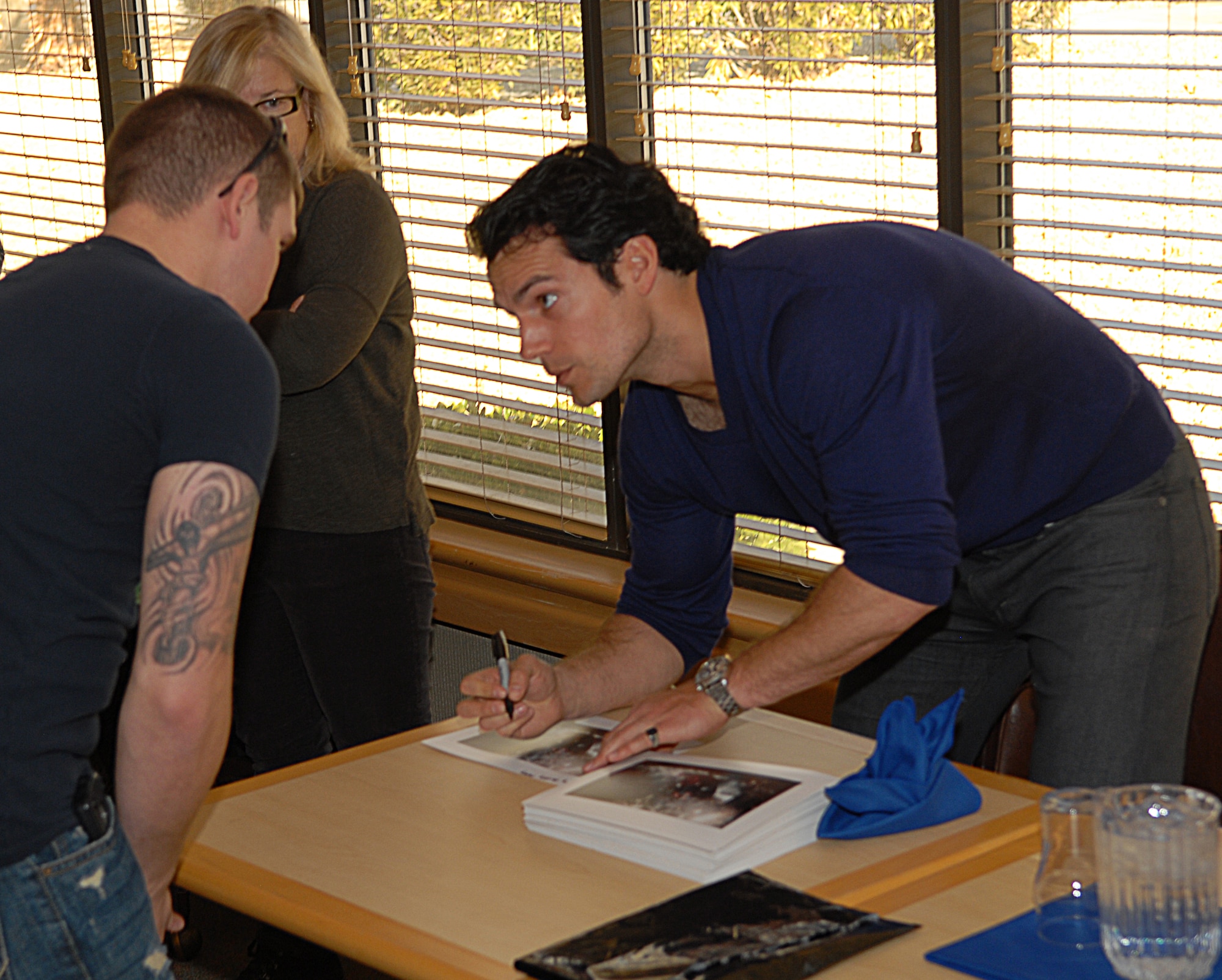 While filming the upcoming movie "Man of Steel," actor Henry Cavill surprised servicemembers with an hour-long autograph session at the Joshua Tree Dining Facility on Jan. 31. With two brothers currently serving in the British armed forces, Cavill has a unique connection to the military. (U.S. Air Force Photo by Laura Mowry)