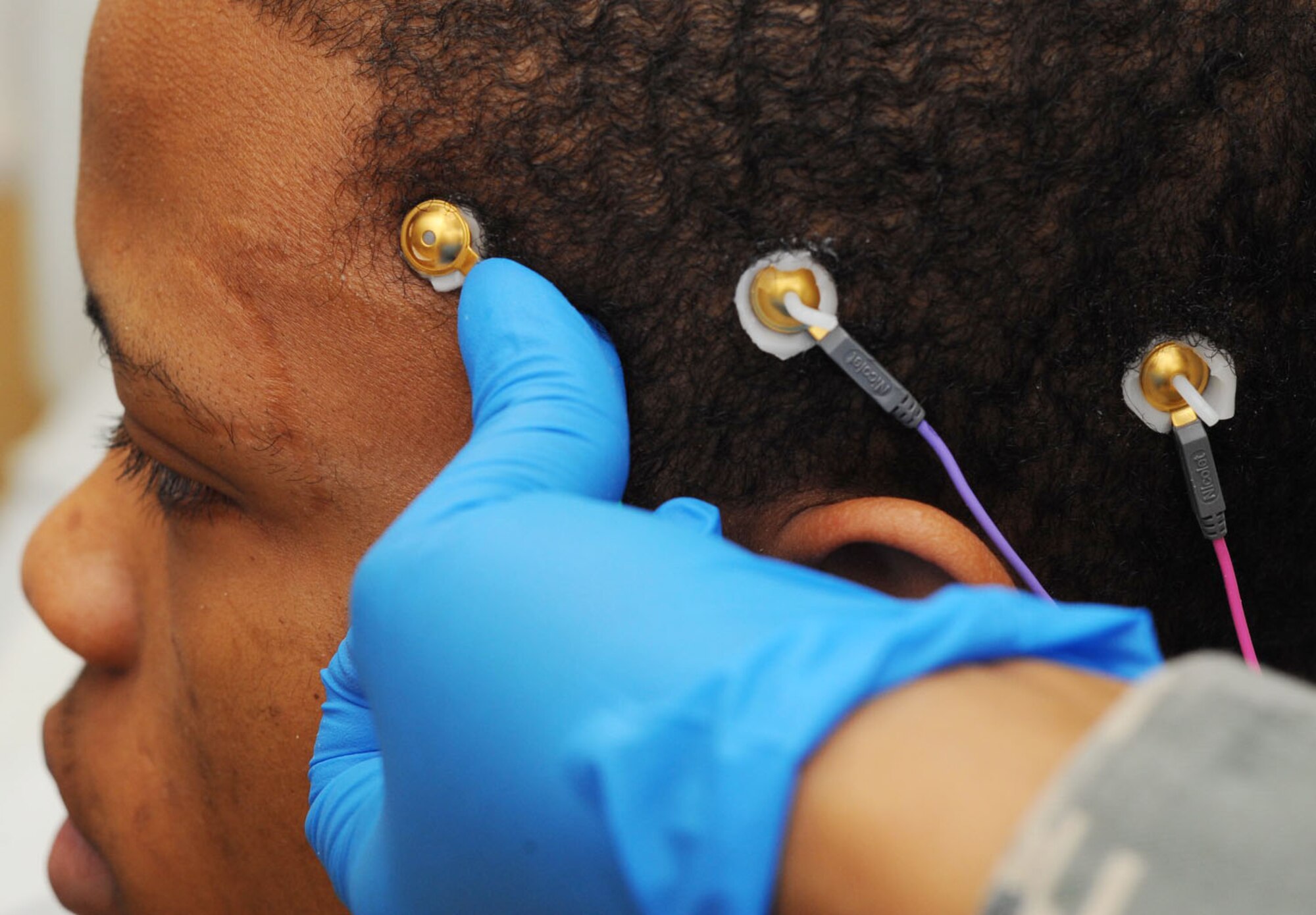 U.S. Air Force Staff Sgt. Tameka Turner, 633rd Medical Group neurology technician, attaches electrodes to Airman 1st Class Rahmel Merriweather, 633rd Medical Group inpatient care medical technician, during a training session at the USAF Hospital Langley at Langley Air Force Base, Va., Jan. 31, 2012. The hospital has been identified by the Air Force Surgeon General as one of seven Air Force Medical Service currency platforms, which includes the additional of neurology services. (U.S. Air Force photo by Tech. Sgt. Barry Loo/Released)