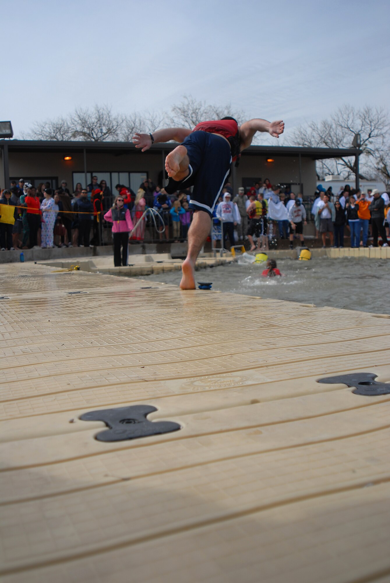 GOODFELLOW AIR FORCE BASE, Texas-- A participant of the annual Polar Bear Swim dives into Lake Nasworthy at the Goodfellow Recreational Camp Feb. 4. A total of 311 registered swimmers jumped into the 38 degree water for the morale boosting event. (U.S. Air Force photo/Airman 1st Class Michael Smith)