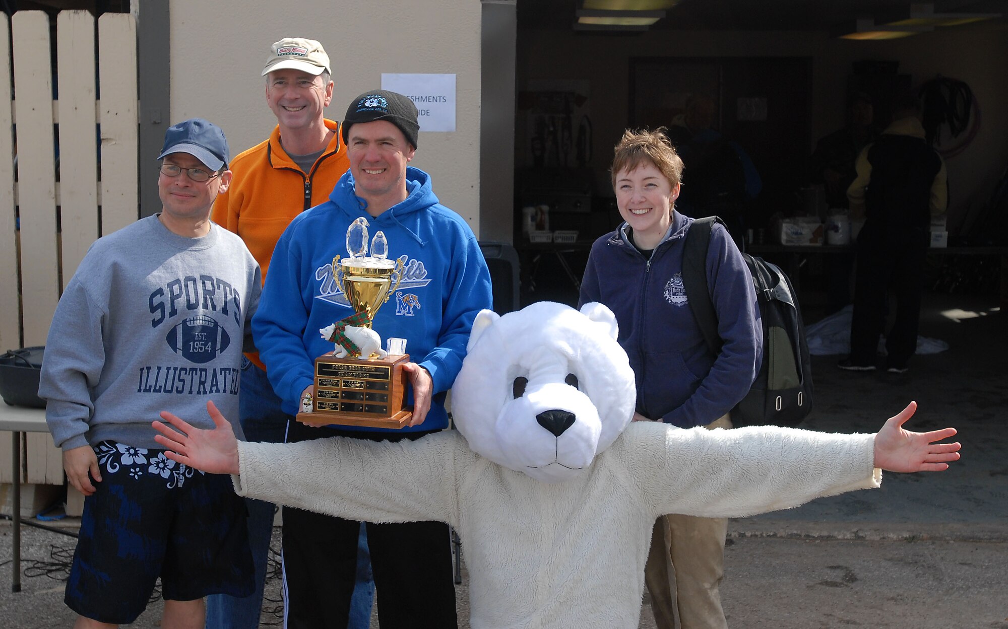 GOODFELLOW AIR FORCE BASE, Texas-- Col. J.D. Willis, 17th Training Group Commander, along with 17th TRG Staff hold the Polar Bear Swim Trophy for the highest percentage of participation at the Goodfellow Recreational Camp Feb. 4. A total of 311 registered swimmers jumped into the 38 degree water for the morale boosting event. (U.S. Air Force photo/Airman 1st Class Michael Smith)