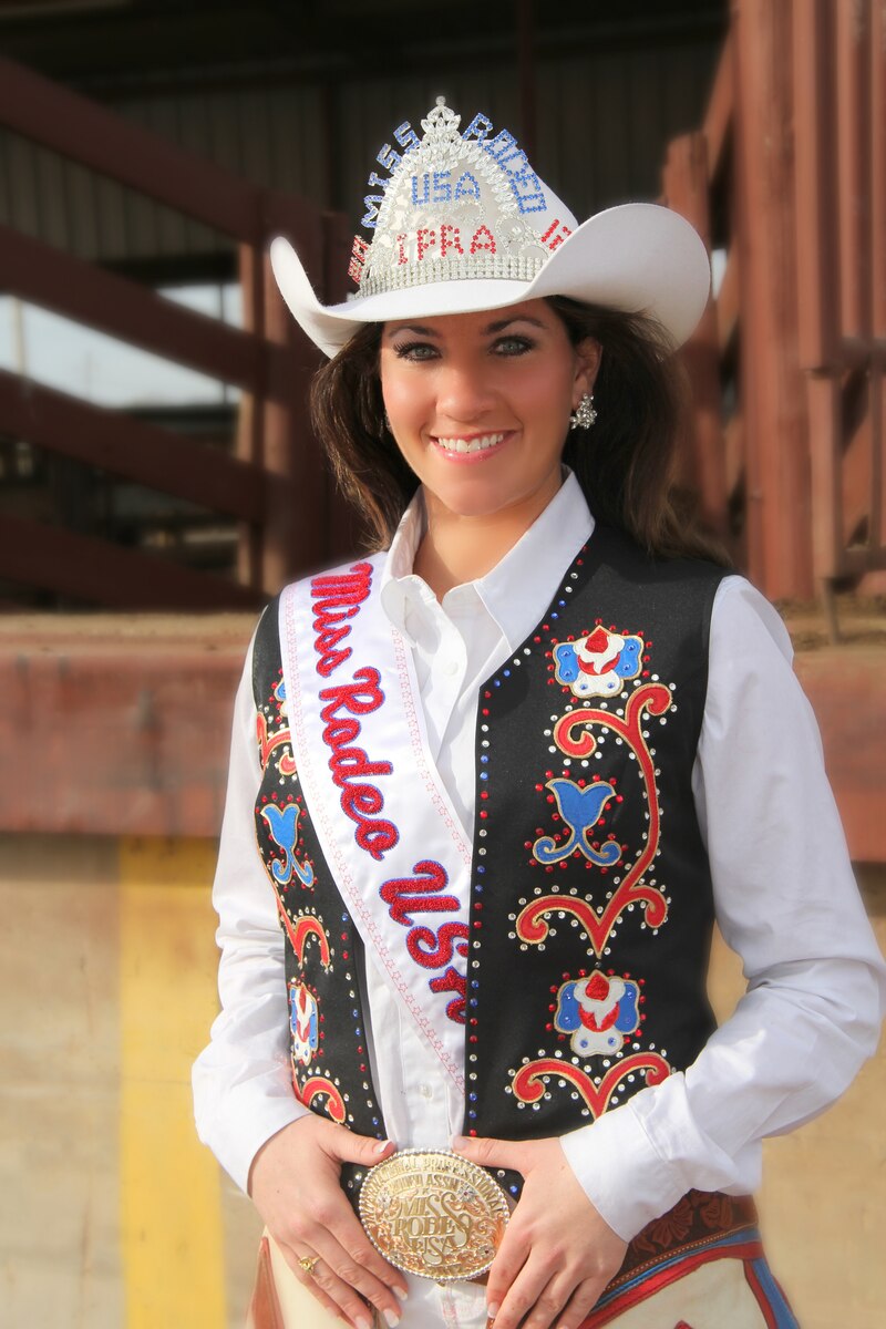 SIOUX FALLS, S.D. – Staff Sgt. Trisha Smeenk, 114th Fighter Wing Public Affairs journalist, was chosen as the 2012 Miss Rodeo USA at the International Finals Rodeo held in Oklahoma City, Okla. Jan. 15, 2012.  Sgt. Smeenk has been a member of the South Dakota Air National Guard for seven years and looks forward to continuing her career with the unit after her reign as Miss Rodeo USA concludes in January 2013.  (Photo provided by Sherry Smith, freelance photographer)(RELEASED)