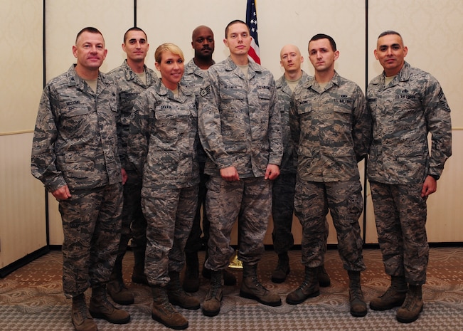 Colonel Richard McComb (left) and Chief Master Sgt. Jose LugoSantiago (right) recognize February's Diamond Sharp winners at the Joint Base Charleston Club Feb. 7. The Diamond Sharp recipients are (front row from left) Senior Airman Taylor Savage, 628th Medical Group, Staff Sgt. Aaron Hellman 373rd Training Squadron, and Airman 1st Class Tom Brading, 628th Air Base Wing Public Affairs. Pictured with the Diamond Sharp winners are Master Sgt. Christopher Robinson, 628th MDG, Master Sgt. Julius Walker, 373rd TRS Squadron and Master Sgt. John Gott, 628th ABW /PA. Diamond Sharp awardees are Airmen chosen by their first sergeants for their excellent performance. McComb is the JB Charleston commander and LugoSantiago is the JB Charleston command chief. (U.S. Air Force photo/Staff Sgt. Katie Gieratz)

