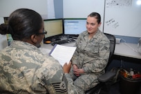 Tech. Sgt. Shakira Merrells and Senior Airman Rachel Meyer, 902nd Communications Squadron Air Force Enterprise Service desk,discuss Meyer's recent Enlisted Performance Report at Joint Base San Antonio-Randolph Feb. 7.  (U.S. Air Force photo/Rich McFadden) (released)