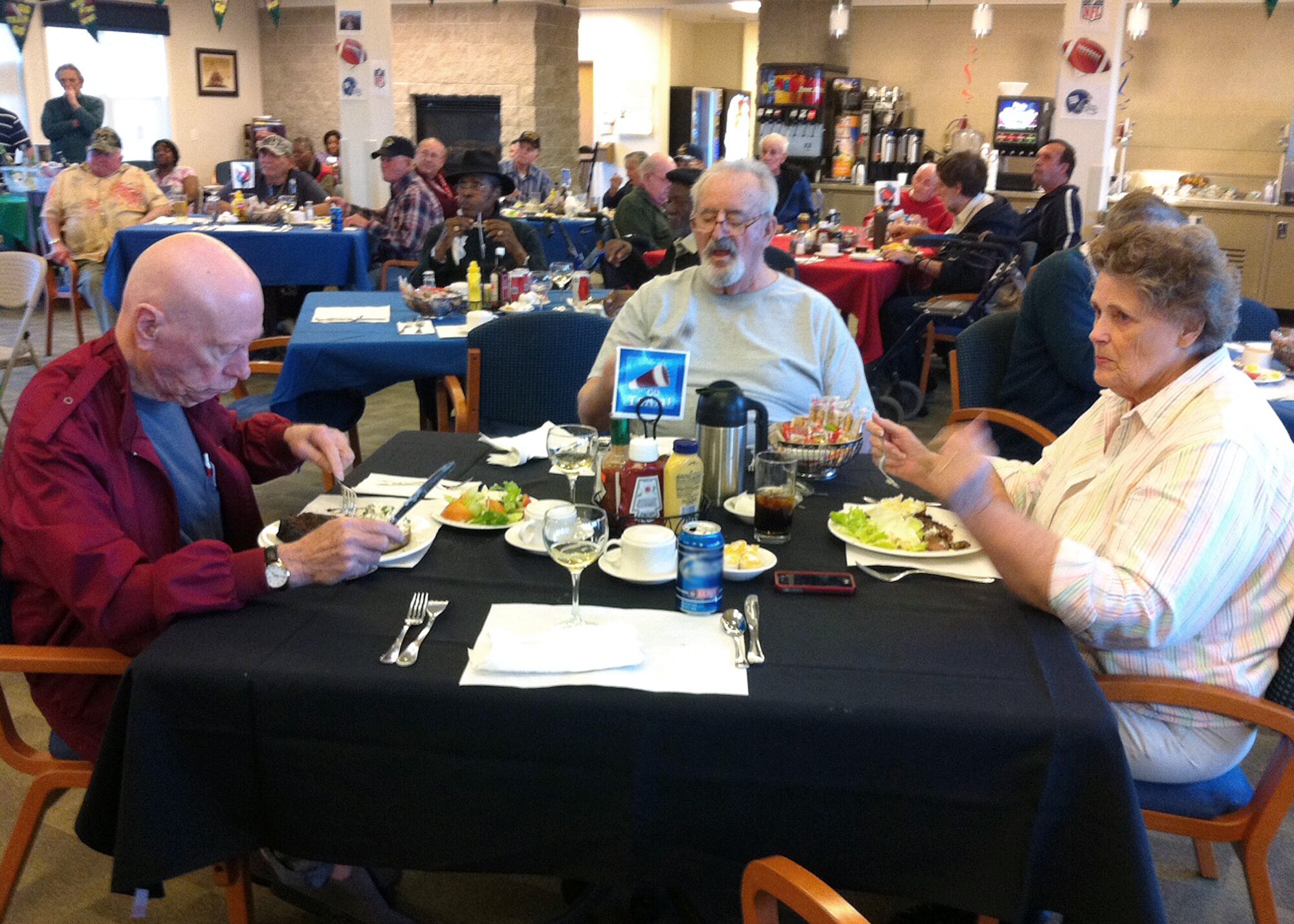 Veterans get treated to a steak dinner prepared by the Air Force Sergeants Association at Edwards during a Super Bowl party at the William J. "Pete" Knight Veterans Home in Lancaster, Calif. on Feb. 5.
