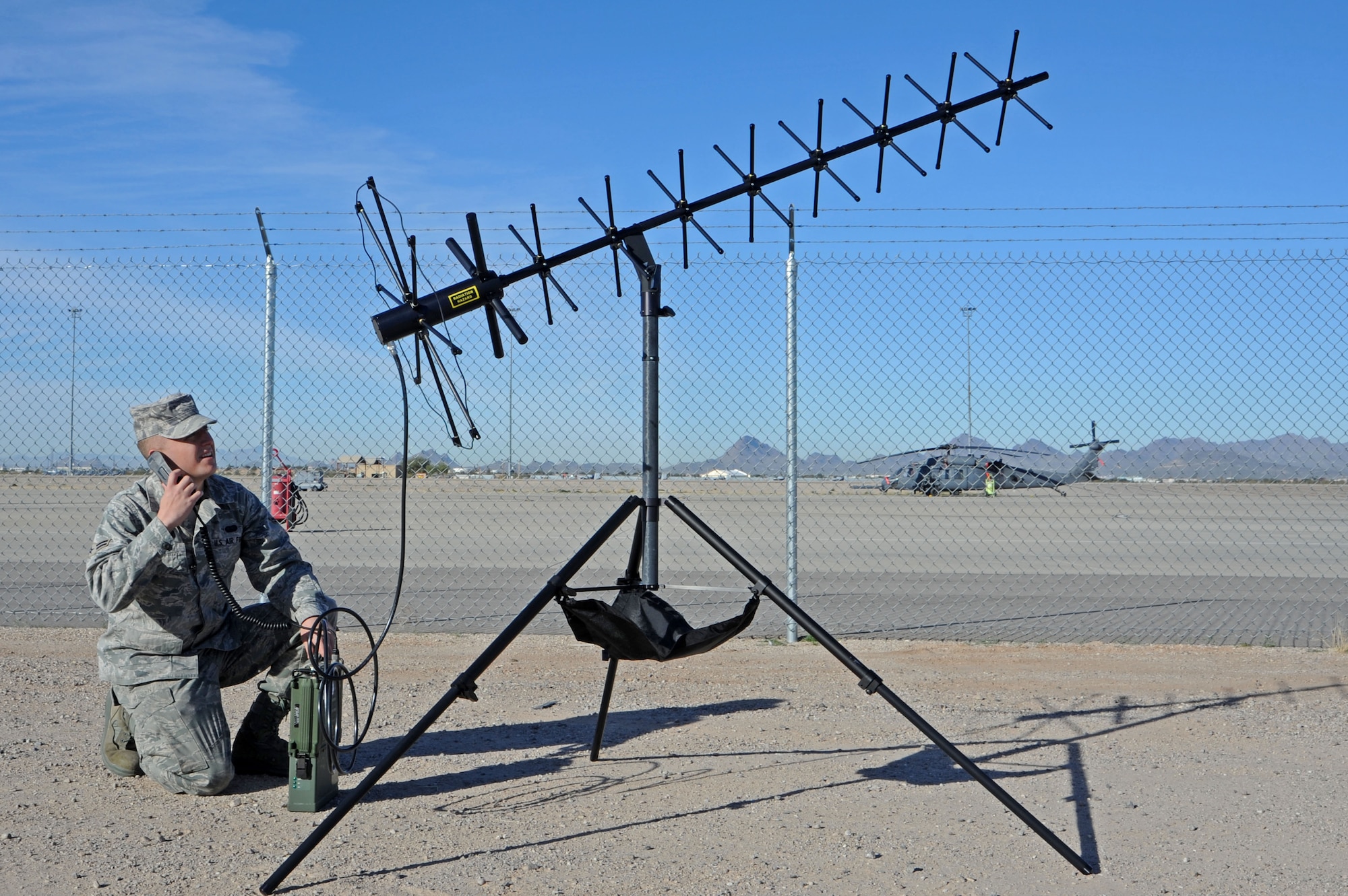 U. S. Air Force Airman 1st Class Taylor Urreta, 355th Communications Squadron radio frequency transmission systems journeyman, tests a portable man packed radio at Davis-Monthan Air Force Base, Ariz., Feb. 2, 2012. The radio is used by special ops to communicate back to the base station when on a mission. (U.S. Air Force photo by Airman 1st Class Camilla Griffin/Released)