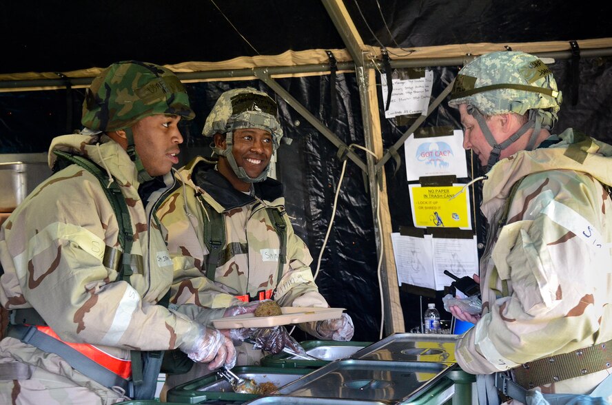 Air National Guardsmen from the 116th Services Flight serve lunch from a field dining tent at Robins Air Force Base, Ga., Feb. 3, 2012. The Guardsmen set up and served meals from the field tent during an Operational Readiness Exercise. (Air Force photo by Master Sgt. Roger Parsons) 


