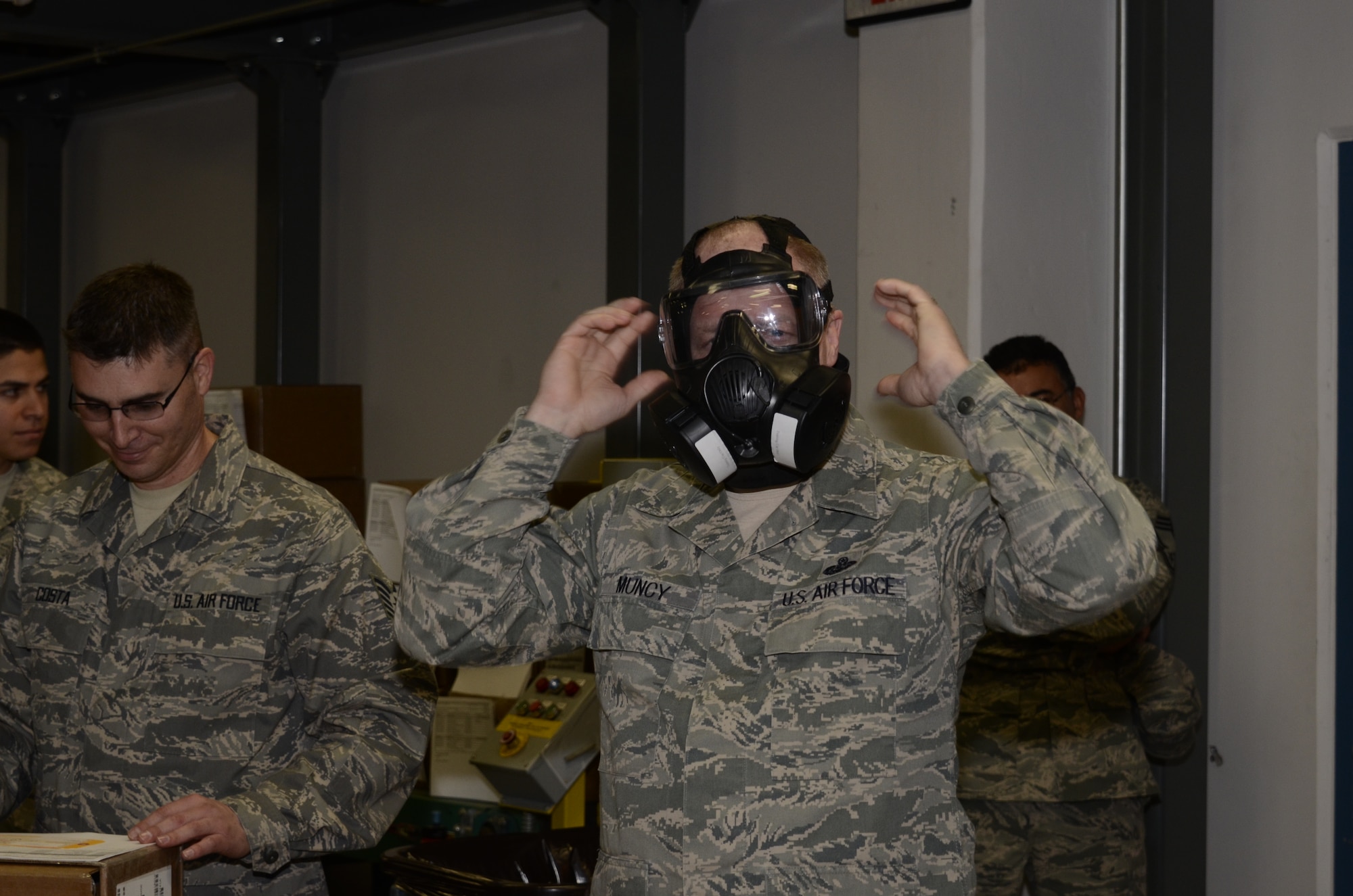 Chief Master Sergeant Chris Muncy, Command Chief Master Sergeant of the Air National Guard, tries on the new M50 Joint Service General Purpose Mask while visiting the 144th Logistics Readiness Squadron, 144th Fighter Wing, California Air National Guard, on February 4, 2012.  During Chief Muncy’s visit, he spoke with several Airmen from various shops and offices telling them how important it is to tell the Air National Guard story.  (Air National Guard photo by Tech. Sgt. Robin Meredith)