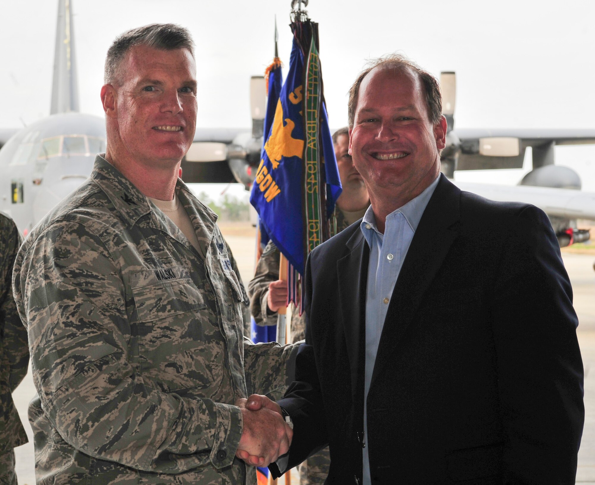 U.S. Air Force Col. Paul Walski, 93d Air Ground Operations Wing vice commander, shakes hands with the incoming 93d AGOW honorary commander, Dick Campbell, during the Honorary Commander Change of Command Ceremony at Moody Air Force Base, Ga., Feb. 3, 2012. Both honorary and base commanders use this partnership as an opportunity to learn more about each other’s roles and responsibilities within the base and local community. (U.S. Air Force photo by Staff Sgt. Stephanie Mancha/Released)