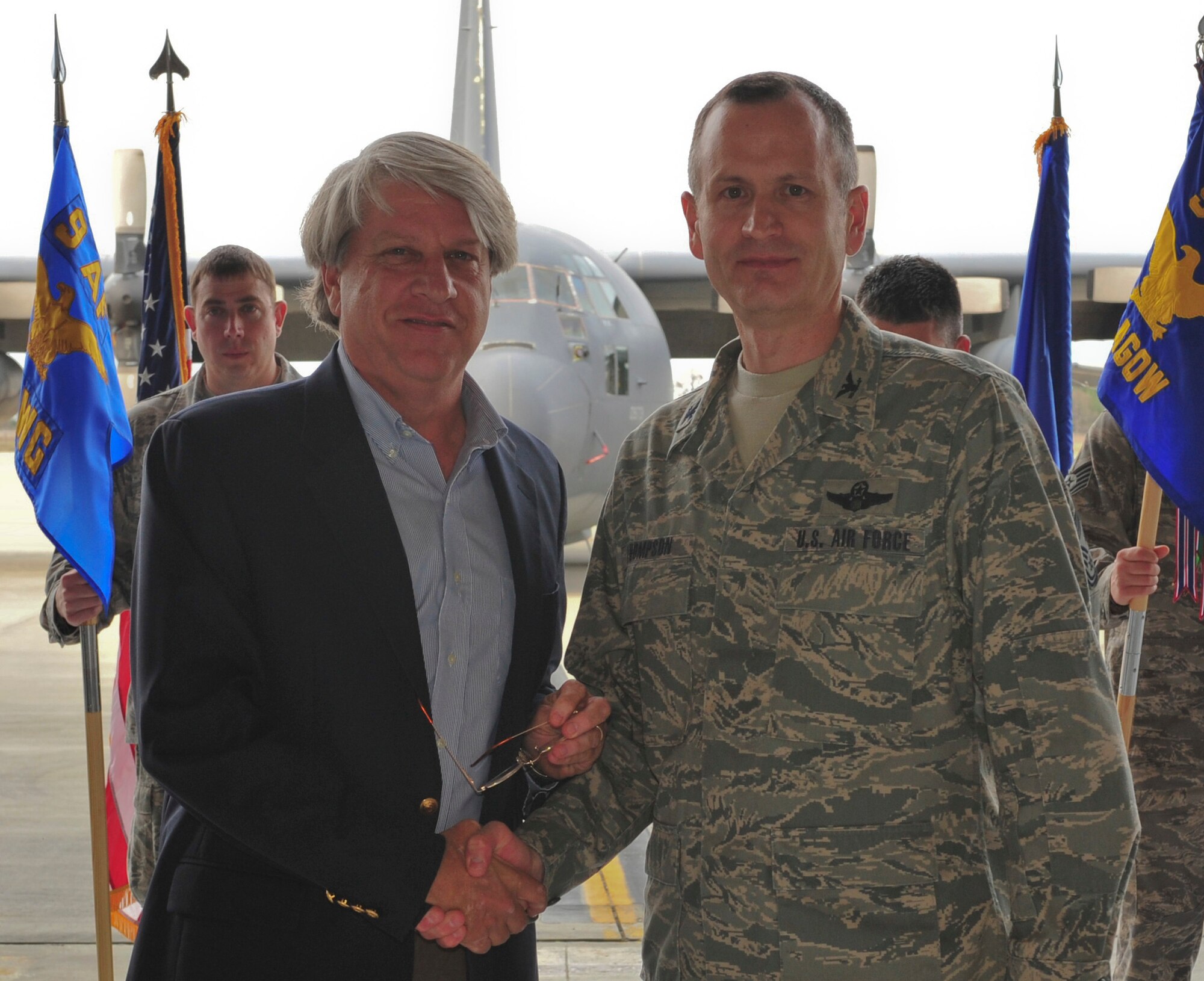 U.S. Air Force Col. Billy Thompson, 23d Wing commander, shakes hands with incoming 23d Wing honorary commander, Chuck Steel, during the Honorary Commander Change of Command Ceremony at Moody Air Force Base, Ga., Feb. 3, 2012. The honorary commander program increases public awareness and understanding of Moody’s mission, policies and programs through building relationships. (U.S. Air Force photo by Staff Sgt. Stephanie Mancha/Released)
