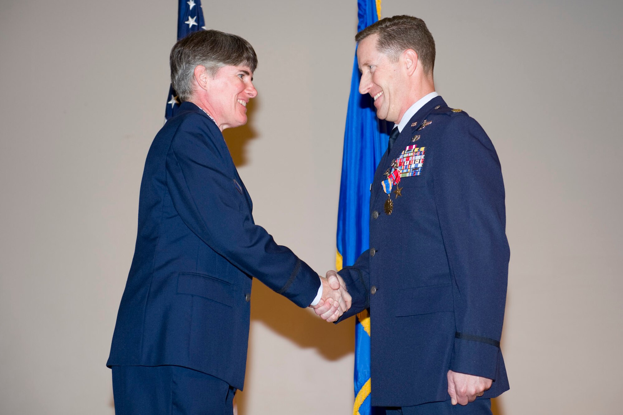PATRICK AIR FORCE BASE, Fla. -- Col. Denette Sleeth, 45th Operations Group commander, congratulates Lt. Col. David L. Hamby, commander, Detachment 3, 45 OG, for his receipt of the Bronze Star Medal on Jan. 24, 2012. Colonel Hamby distinguished himself while engaged in ground operations as  commander of the 26th Expeditionary Rescue Squadron, Camp Bastion, Afghanistan, from Nov. 6, 2010 to March 2, 2011.