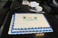 The cake provided in celebration for the 100th on time production aircraft delivered since the 571st Aircraft Maintenance Squadron Operating Location A was stood up at Joint Base San Antonio-Randolph. (U.S. Air Force photo/Rich McFadden) (released)