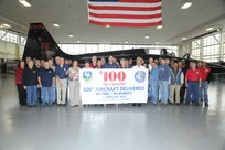 Members of the 571st Aircraft Maintenance Squadron Operating Location A pose in front of the 100th on time production aircraft delivered at Joint Base San Antonio-Randolph Feb. 6. (U.S. Air Force photo/Rich McFadden) (released) (U.S. Air Force photo/) (released)