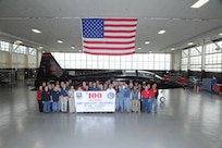 Members of the 571st Aircraft Maintenance Squadron Operating Location A pose in front of the 100th on time production aircraft delivered at Joint Base San Antonio-Randolph Feb. 6. (U.S. Air Force photo/Rich McFadden) (released) (U.S. Air Force photo/) (released)