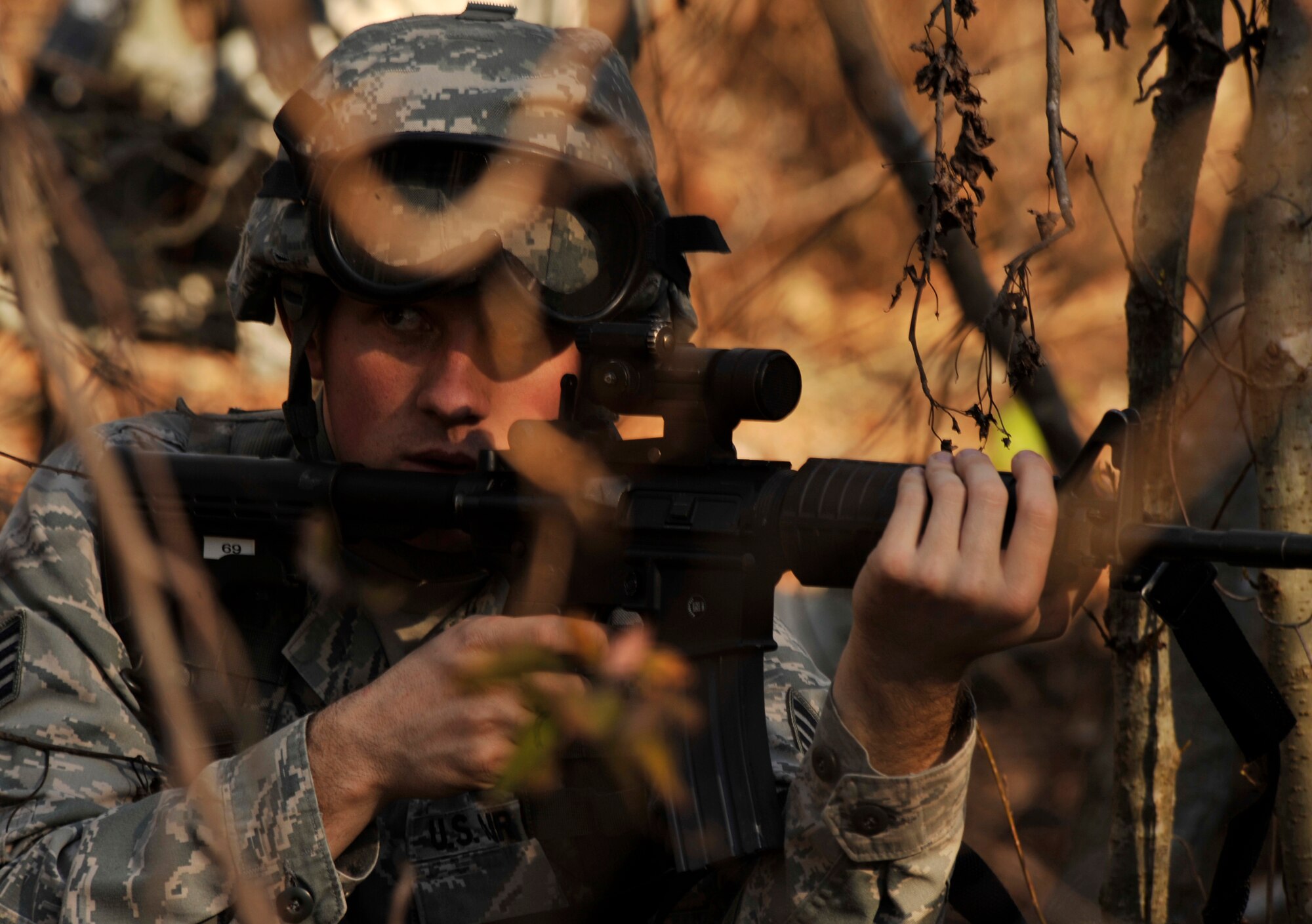 U.S. Air Force Staff Sgt. Jeffrey Towe, 169th Security Forces Squadron Air National Guard, scans his sectors as his team responds to a simulated insurgent group posing a threat to local aircraft during Operation Rita, a joint exercise, at McEntire Joint National Guard Base, S.C., Feb. 2, 2012. The 169th SFS Airmen were transported by S.C. Army National Guard UH-60 Black Hawks to a destination near alleged group activity to begin a simulated reconnaissance mission. Operation Rita gave security forces the chance to become familiar with Army aviation, including loading and unloading from active helicopters. (U.S. Air Force photo by Senior Airman Tabatha McCarthy/Released)