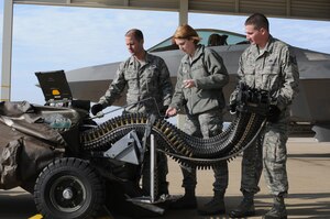 Staff Sgt. Christopher A. Stacklin, Airman 1st Class Darby J. Ryan and Staff Sgt. Greg K. Wills, Virginia Air National Guard 192nd Fighter Wing F-22 Raptor weapons loaders, conduct an inspection on a Universal Ammunition Loading System at Langley Air Force Base, Va., Jan. 26, 2012. The 192nd Maintenance and Operations Groups each recently received the Air Force Outstanding Unit Award for their accomplishments over the past two years. (U.S. Air Force photo by Master Sgt. Carlos Claudio/Released)